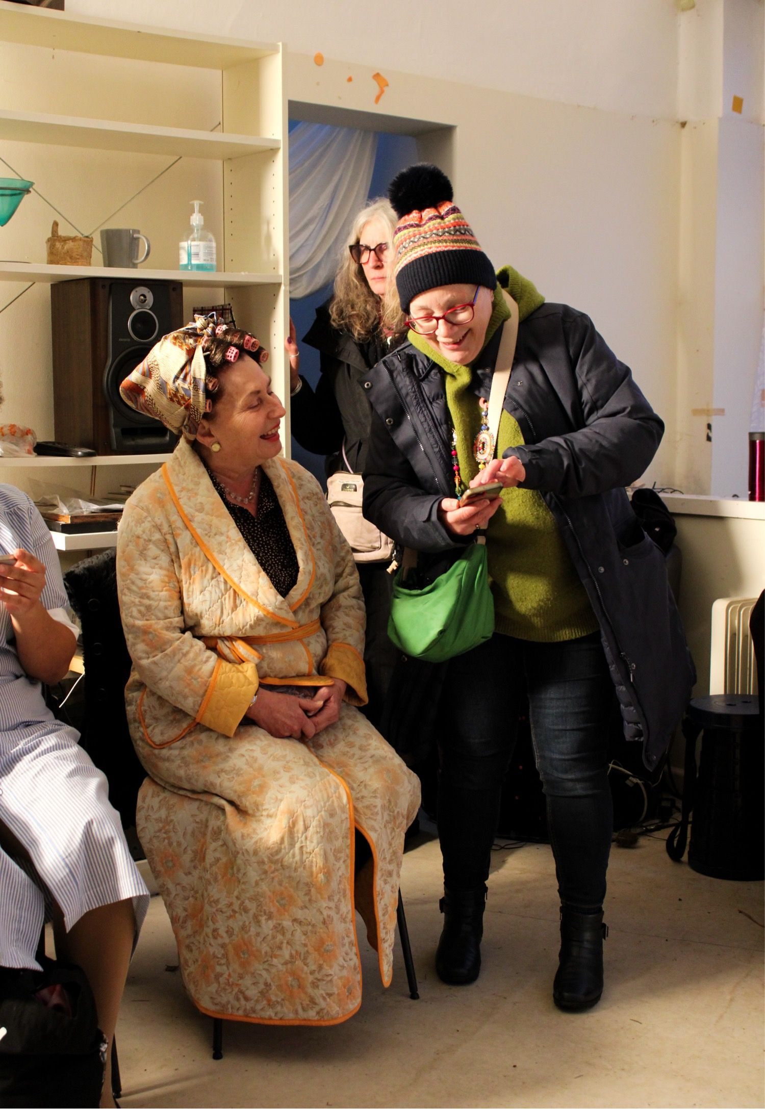 Cast members in costume between takes