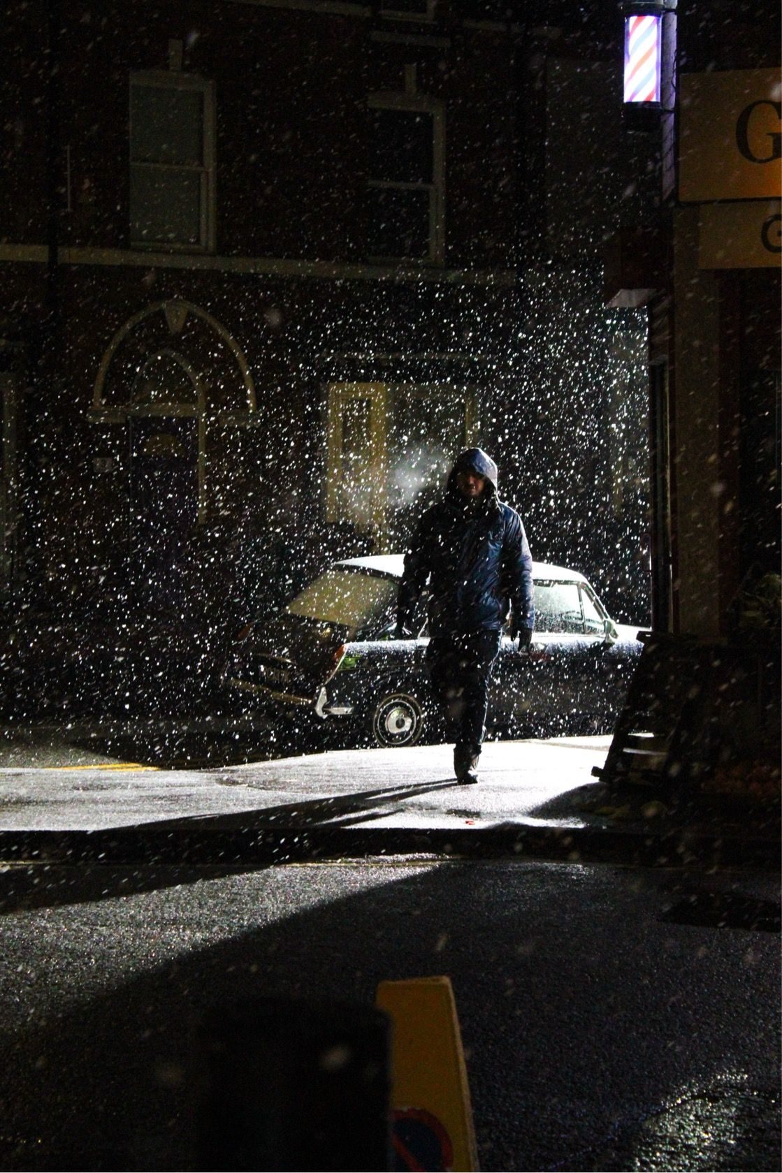 Figure in a snowstorm at night on the film set