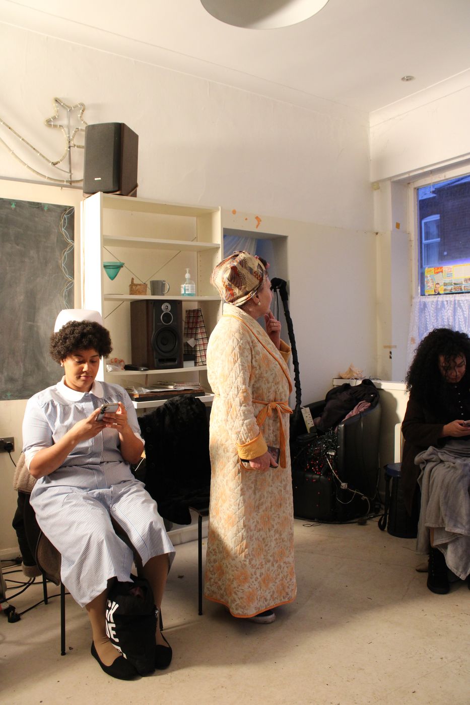 Actor in period leather jacket — costume detail on the film set