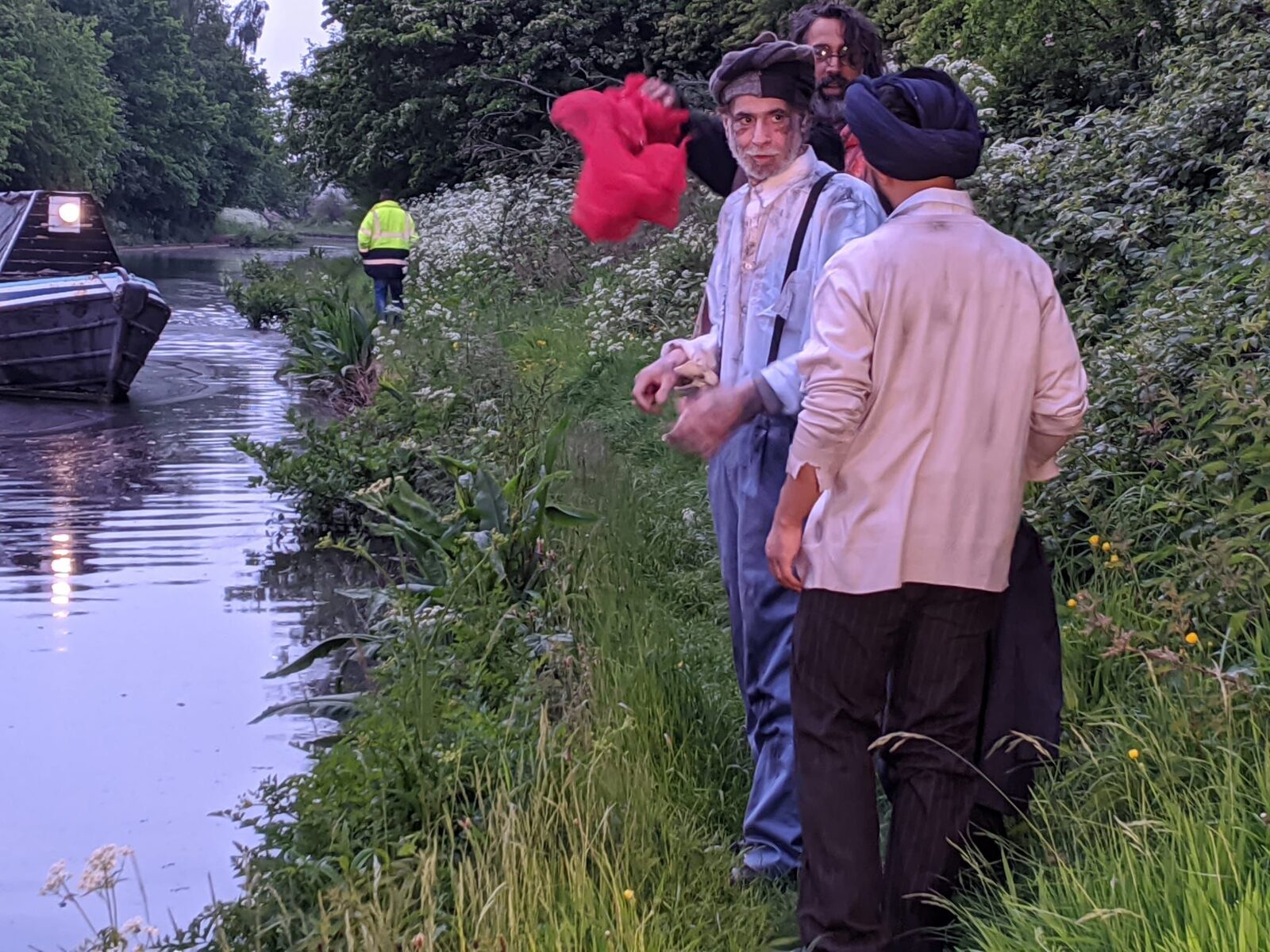 Cast members in period costume on the canal bank, preparing to shoot The Bridge