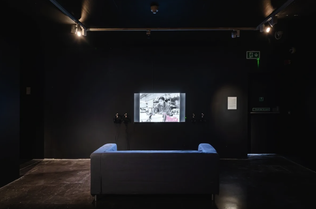 Gallery space with light installation, The Exiles