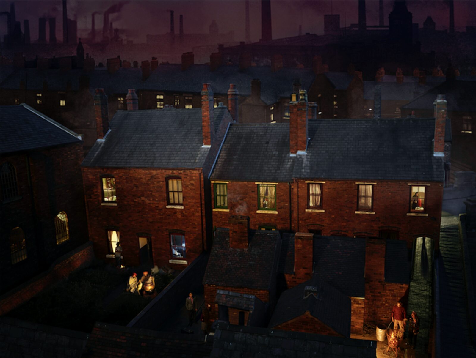 Dayshift — terraced houses at dusk with factory chimneys, from The Exiles photographic series