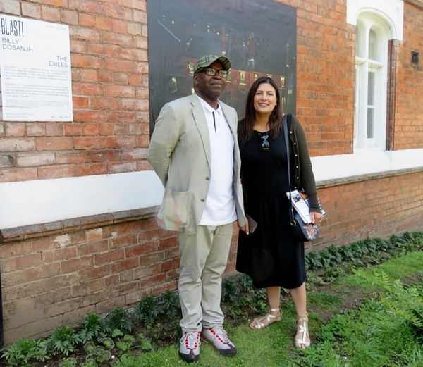 Visitors at the BLAST! Photo Festival exhibition of The Exiles
