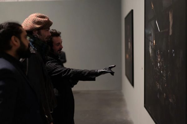 An Exiles print displayed on an exterior wall at a community venue