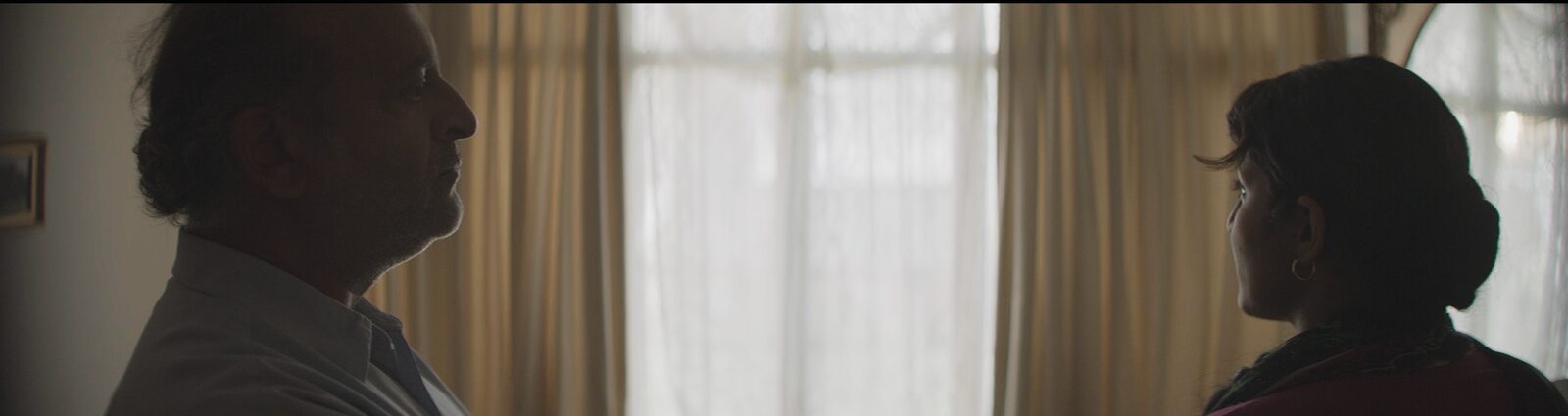 Father and Indi in silhouette — a quiet domestic moment