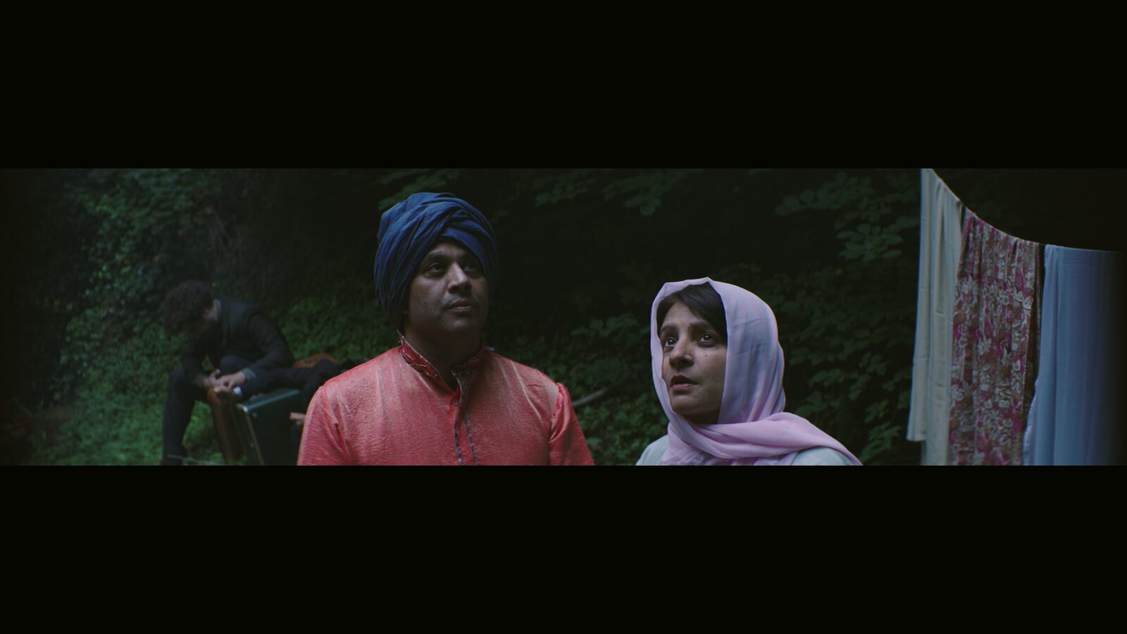 Sardar and Sheeru in a night-time outdoor scene